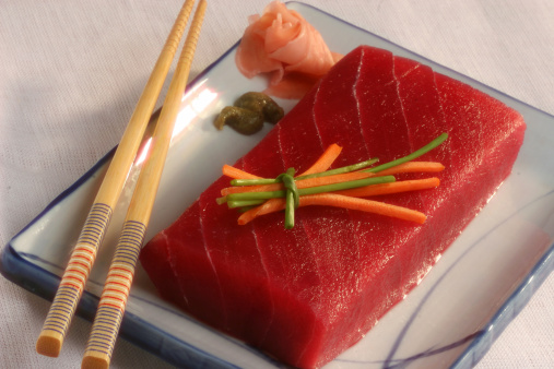 Japanese mix seafood sashimi don. Fresh salmon sashimi don. Raw salmon roe and wasabi. Japanese food on restaurant table. Isolate on wood background