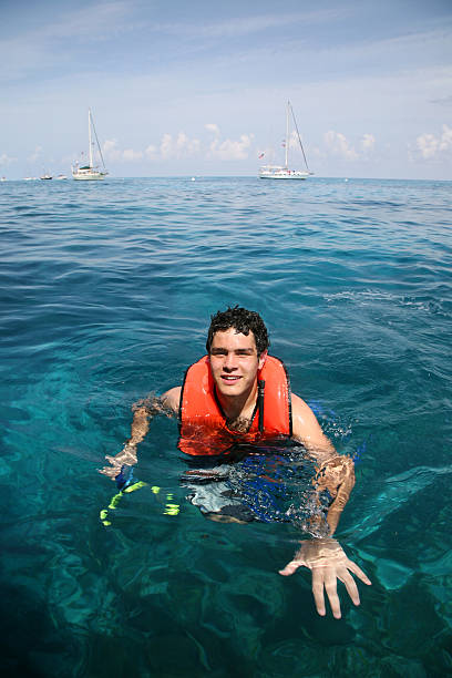 istock Young man snorkeling in the Caribbean 114425872