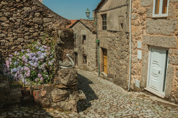 istock Old houses and stone staircase with flowers 1144260101