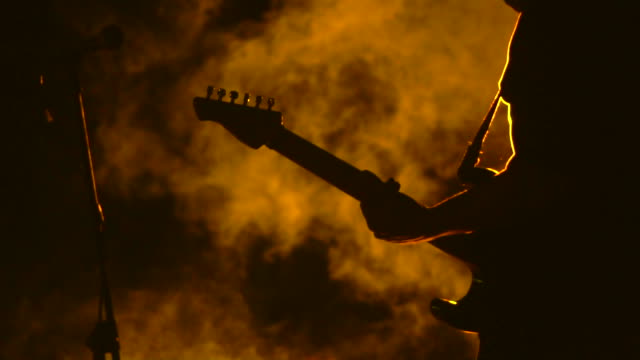Guitarist playing guitar close up