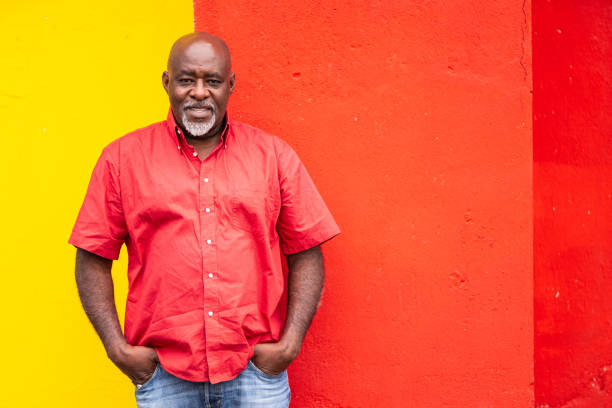 istock Mature afro man portrait on colorful background 1144260904