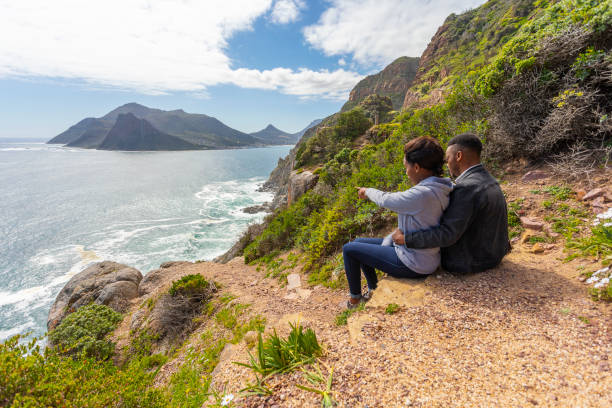 istock African Couple Hugging and Enjoying the Ocean View 1144262971