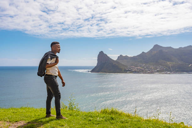 istock Casual African Man Looking at the Ocean View 1144262987