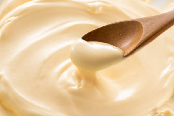 istock Wooden spoon with mayonnaise 1144265715