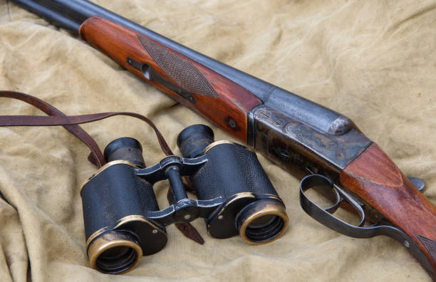istock Vintage shotgun and binoculars. 1144266235