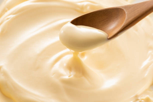 istock Wooden spoon with mayonnaise 1144266295