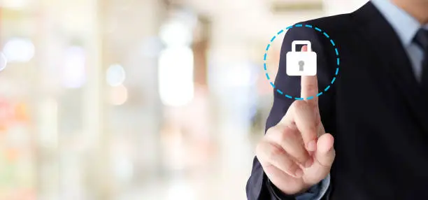 Photo of Businessman hand touching  cyber security icon over blur background with copy space,business and technology background, banner