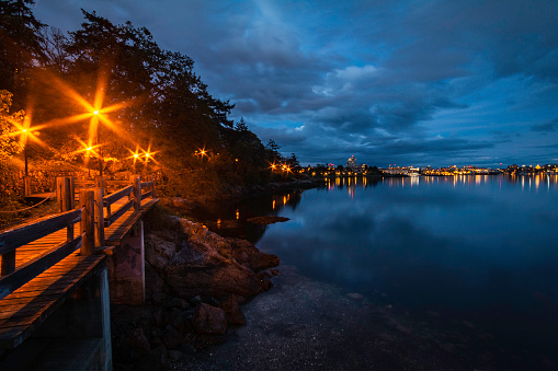 West Bay marina and boardwalk at night.