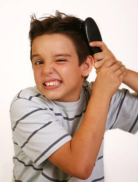 istock little boy brushing his hair 114427065