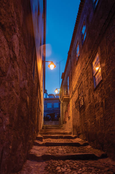 istock Alley with steps and stone houses at night 1144271774