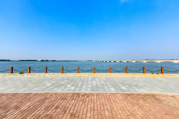 istock Beautiful lake and walkway with blue sky 1144272072