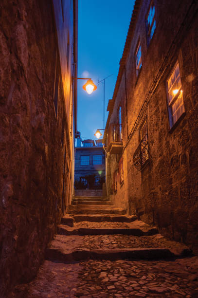 istock Alley with steps and stone houses at night 1144272111