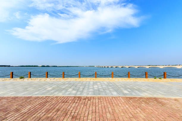 istock Beautiful lake and walkway with blue sky 1144272125