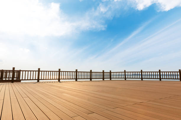 Lakeside wood floor platform and blue sky with white clouds