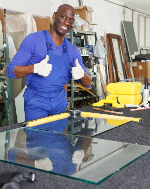 istock satisfied African-American workman in blue overalls 1144277316