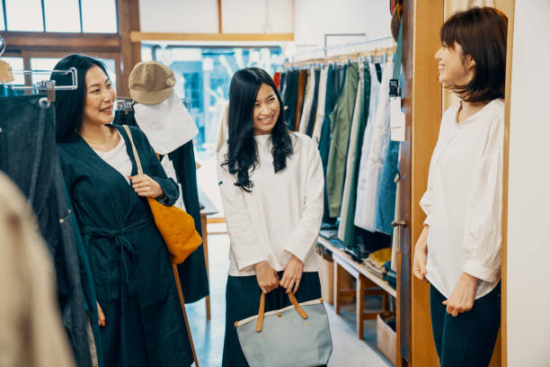 istock Three women trying on clothes in a clothing store 1144277637