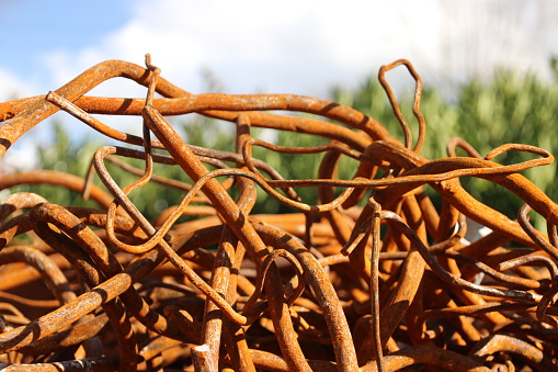 Rusty iron collected in container after demolishment of a former school