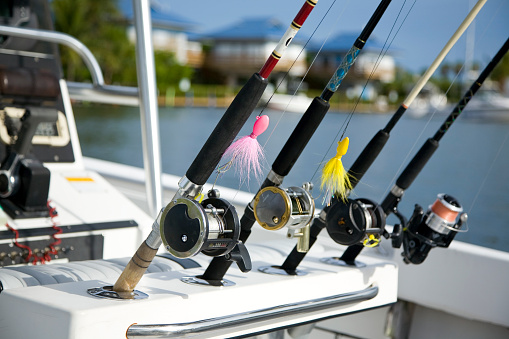 four fishing reels in a boat ready to fish in Islamorada , Florida