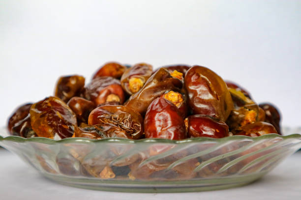 istock bowl of dried dates fruits 1144280737