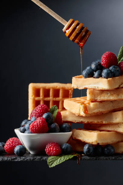 istock Waffles with  blueberries, raspberries  and fresh mint. 1144281660