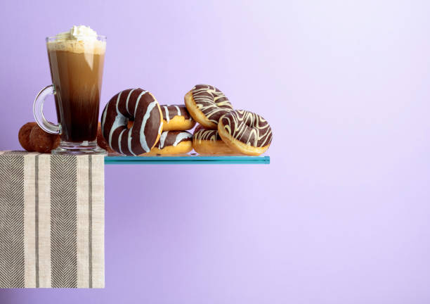 istock Chocolate donuts and coffee with cream. 1144281683
