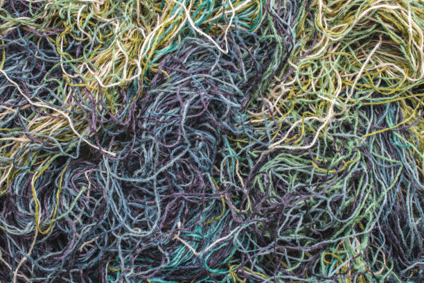 istock background of colored threads chaotically intertwined. green yellow and brown threads matted in a colorful background 1144283262