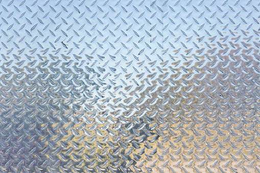 Close up of stainless steel Diamond Plate for backgrounds.