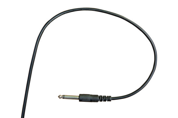 istock Guitar audio jack with black cable isolated on white background with clipping path 1144284467