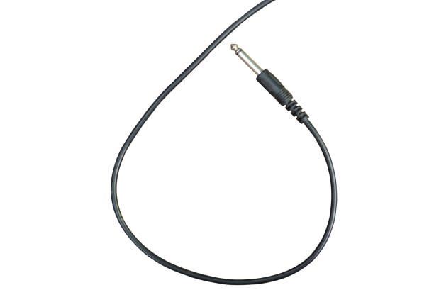 istock Guitar audio jack with black cable isolated on white background with clipping path 1144284535