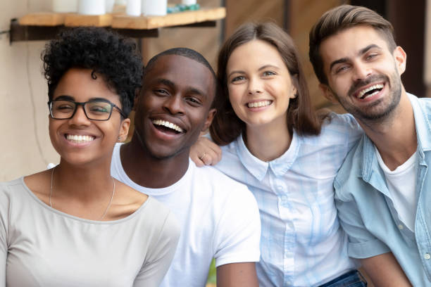 istock Happy multicultural friends group laughing looking at camera, portrait 1144287391