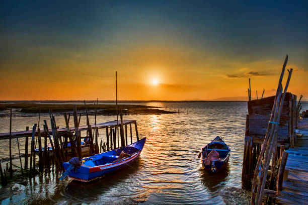 Evening and Sunset at Porto Palafitico, Carrasqueira, Portugal Evening and sunset at Porto Palafitico, Carrasqueira, Portugal troia stock pictures, royalty-free photos & images