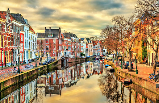 Traditional houses beside a canal in the Hague at sunset. The Netherlands