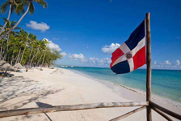 Dominican republic flag in the beach  dominican republic stock pictures, royalty-free photos & images