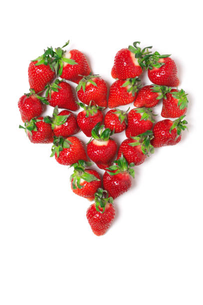 istock Heart shaped pile of strawberries 1144288871