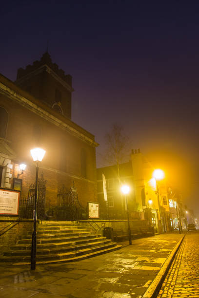 Holy Trinity and St Mary's at night early morning fog High Street Guildford Surrey England