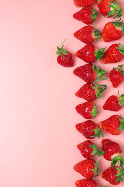 istock Fresh strawberries on pink background 1144288885