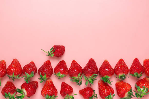 istock Fresh strawberries on pink background 1144288888