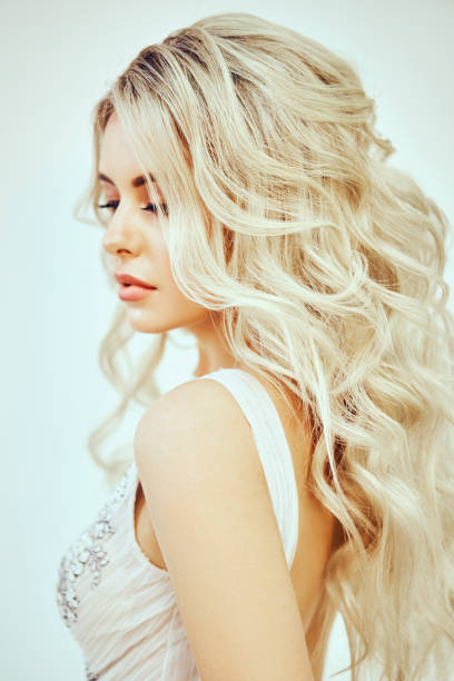 istock Bride with beautiful hair styling in studio on white background. Wedding Mood and Trend Hairstyles. 1144291815