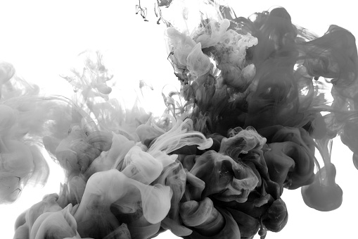 Motion drop in water,Ink swirling in black ink abstraction.Fancy Dream Cloud of ink under water