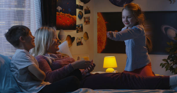 istock Girl entertaining her family with dancing 1144293879