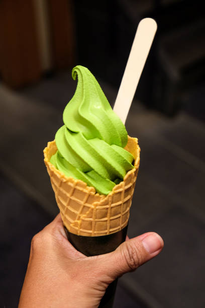 istock Women eating matcha green tea ice cream 1144294224
