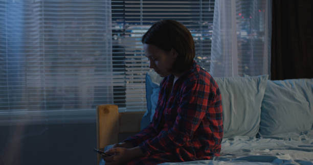 istock Girl sitting alone in her bedroom 1144294510