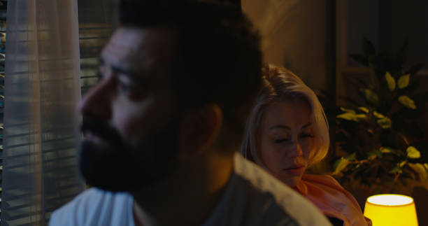 istock Couple sitting on bed after argument 1144294561