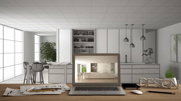 istock Architect designer desktop concept, laptop on wooden work desk with screen showing interior design project, blueprint draft background, modern white kitchen with wooden details 1144295013