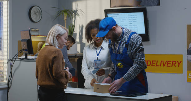 istock Customer receiving package at a customer service desk 1144295041