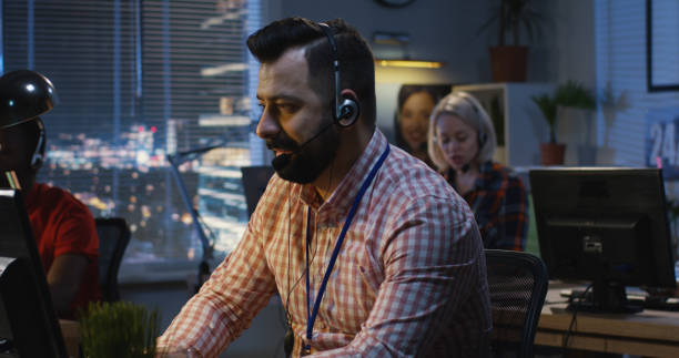 istock Center employee working at his desk 1144295747