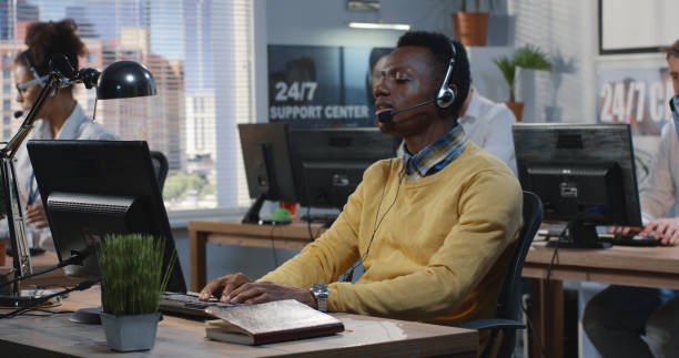 istock Confident young man working at a call center 1144295868