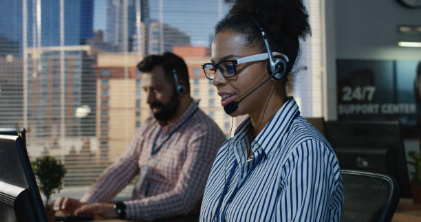 istock Woman working at his desk in a call center 1144295994