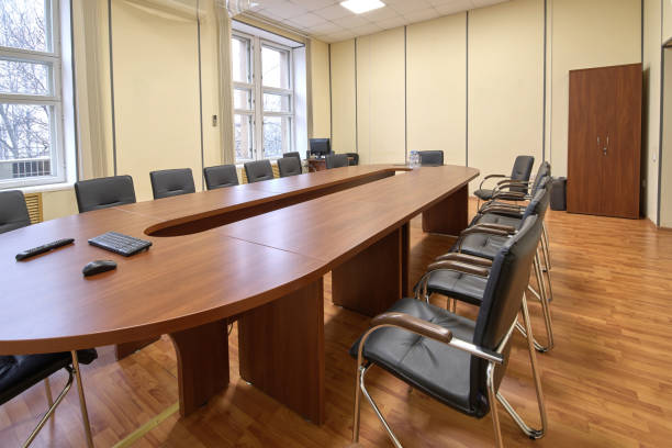 istock Typical office meeting room, long table and chairs 1144297151