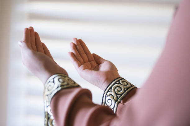 istock Cropped Hands Of Woman Gesturing While Praying At Home 1144297483